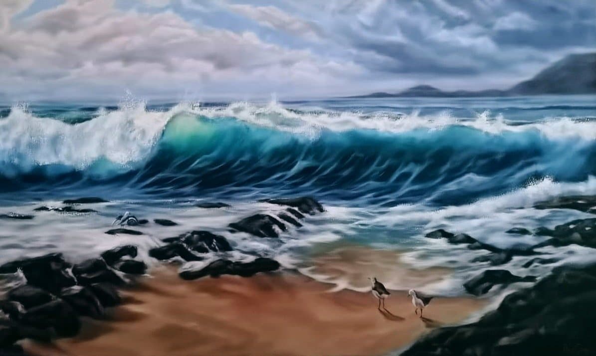 Beach wave with two shorebirds