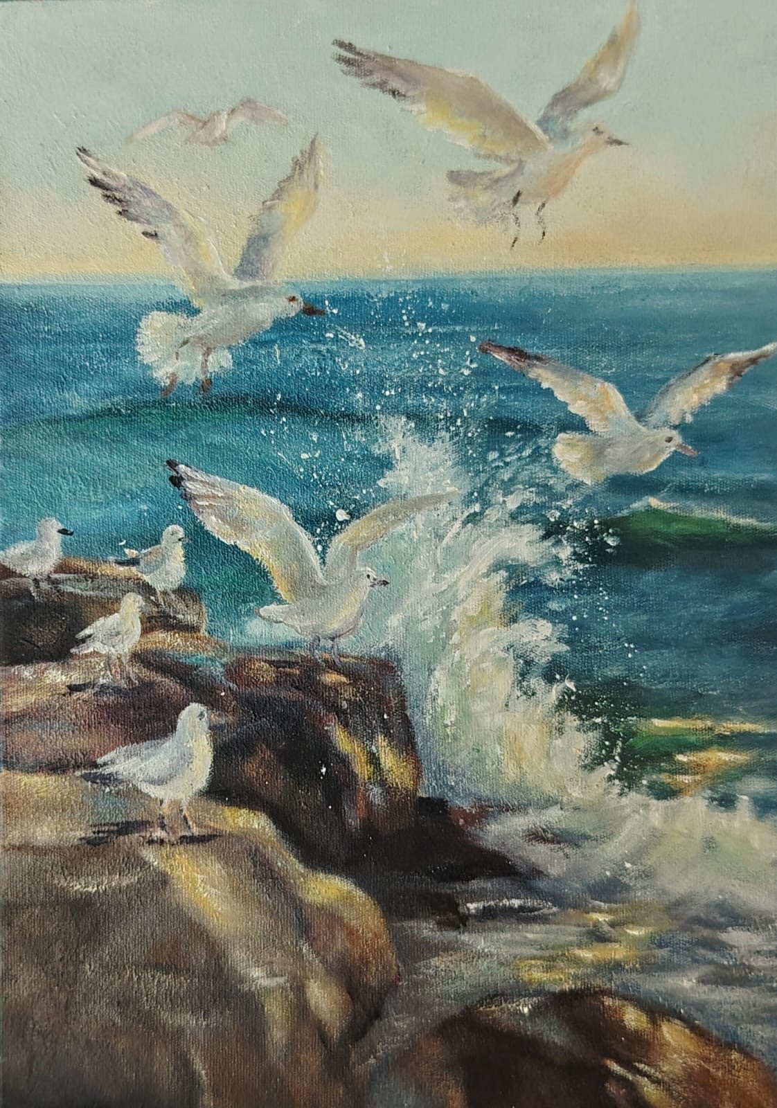 Gulls and crashing surf against rocks