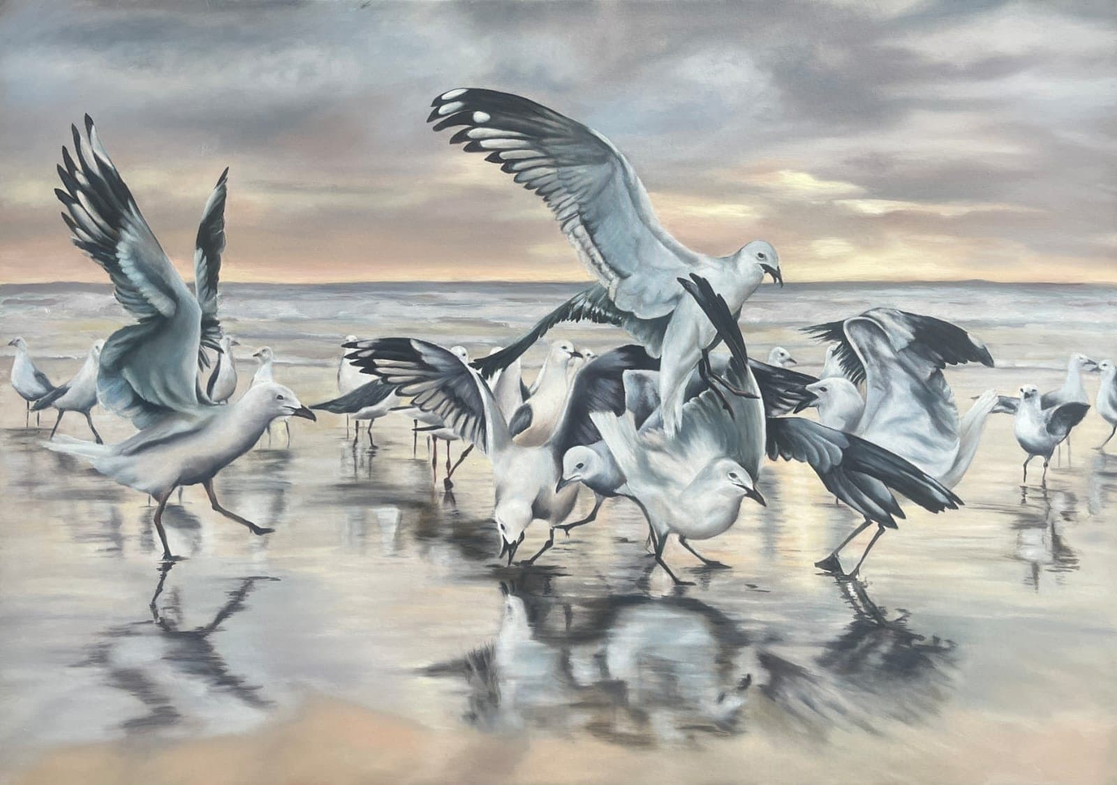 Group of gulls on wet beach