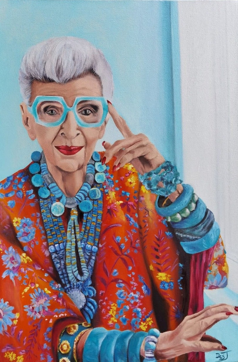 Oil painting depicting portrait in turquoise glasses with orange florals by South African artist Des Green.