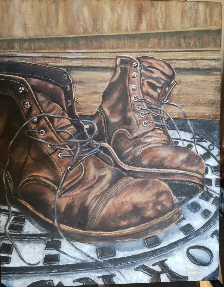 Oil painting depicting brown leather boots by South African artist Des Green.