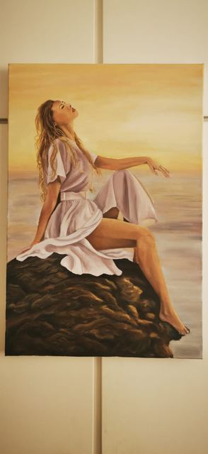 Oil painting depicting woman in white on a rock by South African artist Des Green.