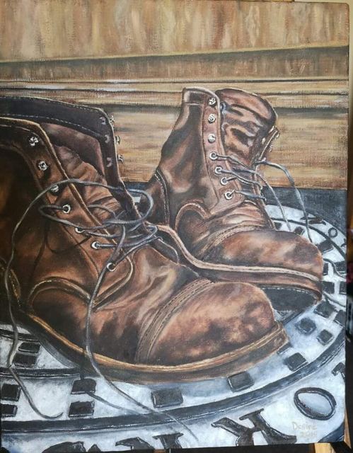 Oil painting depicting brown leather boots by South African artist Des Green.